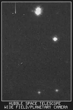 This is the first light image for the Wide Field and Planetary Camera of the Hubble Space Telescope, taken in May 1990; this view is near star HD96755 in the open cluster NGC 3532. This view is 11 by 14 arcseconds of the sky.