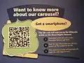 A label in The Children's Museum of Indianapolis that uses a QRpedia code to direct visitors to the Wikipedia article "Broad Ripple Park Carousel"