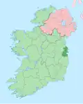 map showing County Dublin as a small area of darker green on the east coast within the lighter green background of the Republic of Ireland, with Northern Ireland in pink