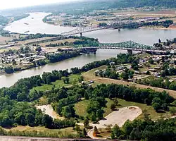 Point Pleasant (foreground) at the confluence of the Kanawha and Ohio Rivers. Gallipolis, Ohio, is in the background right while Henderson, West Virginia, is on the left.