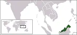 A black and white general world map with East Malaysia highlighted in green
