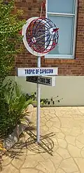 Monument marking Tropic of Capricorn near Civic Centre, Longreach, at mid-day of Summer solstice 2019. The monument is few arc seconds south of the Tropic of Capricorn (notice the shadow directly below the sign)