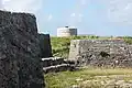 Two of the three forts at Ferry Reach, Ferry Island Fort (in the foreground), and the Martello tower in the background, in 2011. Burnt Point Fort (or Ferry Point Battery), built in 1688, is out of sight, to the left (West).