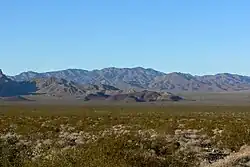 Valley's center-south, from east side. (North end of Highland Range (from east-southeast), McCullough Range massif beyond.)