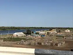 Stary Altynzhar as seen from the bridge across the Kamardan