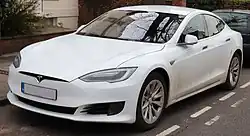 A front three-quarters view of a white 2016 Tesla Model S