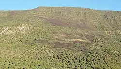 Dark rock on hill