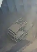 2. The bulldozer pushes cargo to the center of the hold.