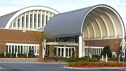 Eden Prairie Library, a brick building with a huge semicircular gray metal covering over its entryway, pictured in 2011