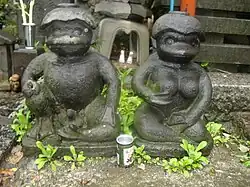 Paired male and female kappa statues at the Sogenji Buddhist shrine at the Asakusa district in Tokyo