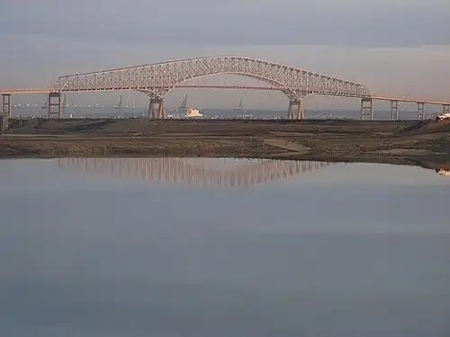Key Bridge with Baltimore in the background, viewed from Cox Creek Industrial Park, in northeast Anne Arundel County, November 2011 to the south