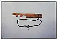 A wooden key found in the cave.