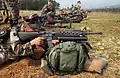A U.S. Marine takes aim with an M16A2 fitted with the M203 40&nbsp;mm grenade launcher.