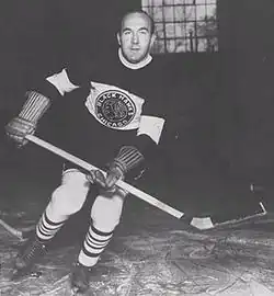 A ice hockey player casually skating