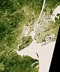 Vegetation is beige (sparse) and deep green (dense)