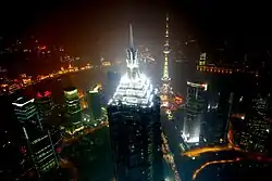 The four mechanical stories forming the spire of the building are brightly illuminated at night